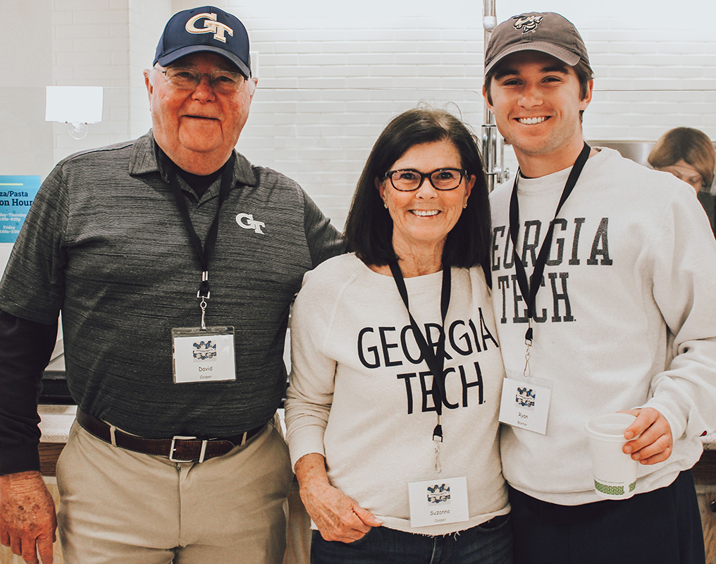 Grandparents and grandson, the student and grandma are wearing GT sweatshirts.