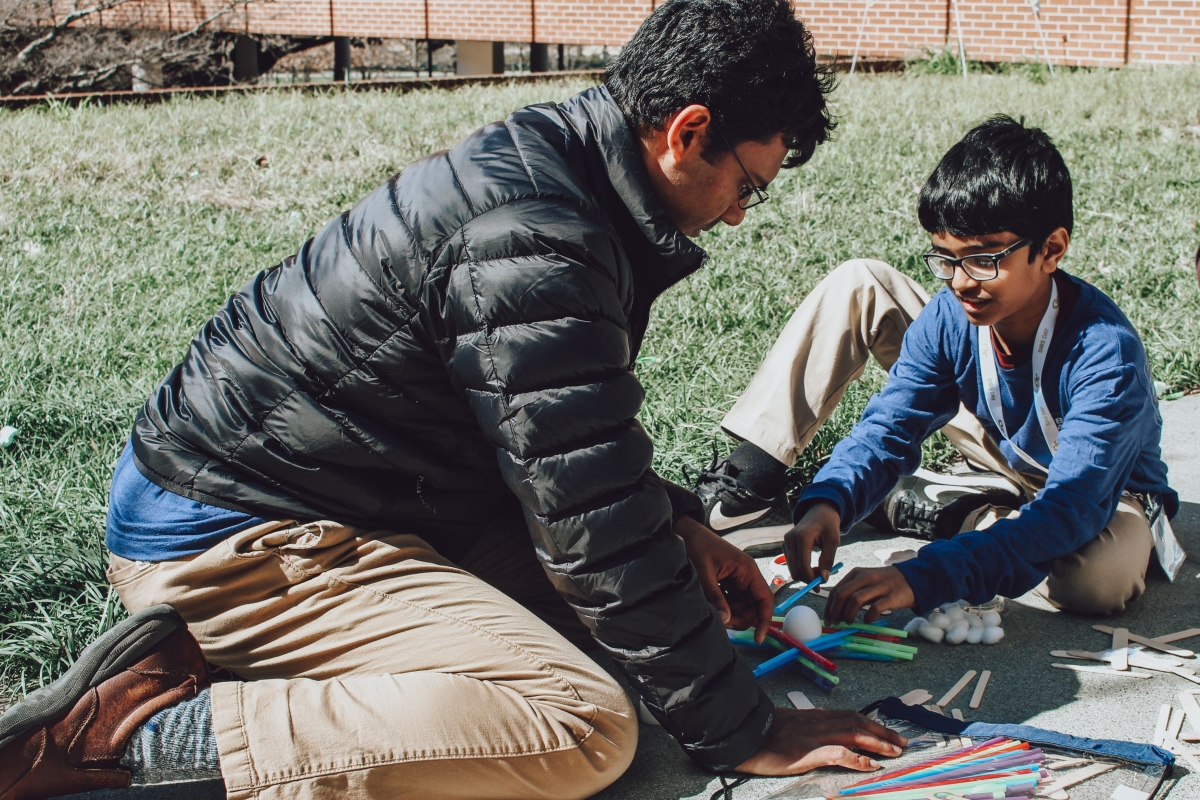 Male GT student plays with little brother.