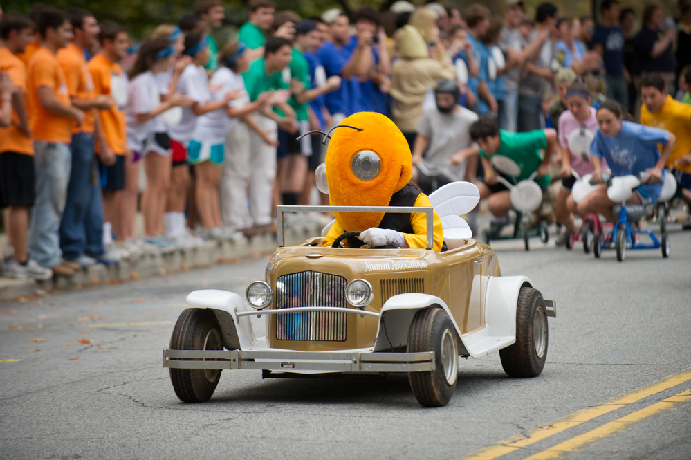 georgia tech mascot Buzz, a yellow jacket, driving a mini model-T Ford Ramblin' Wreck