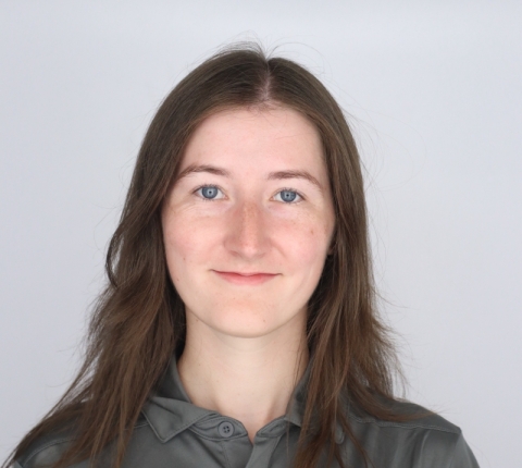 student in professional gray polo